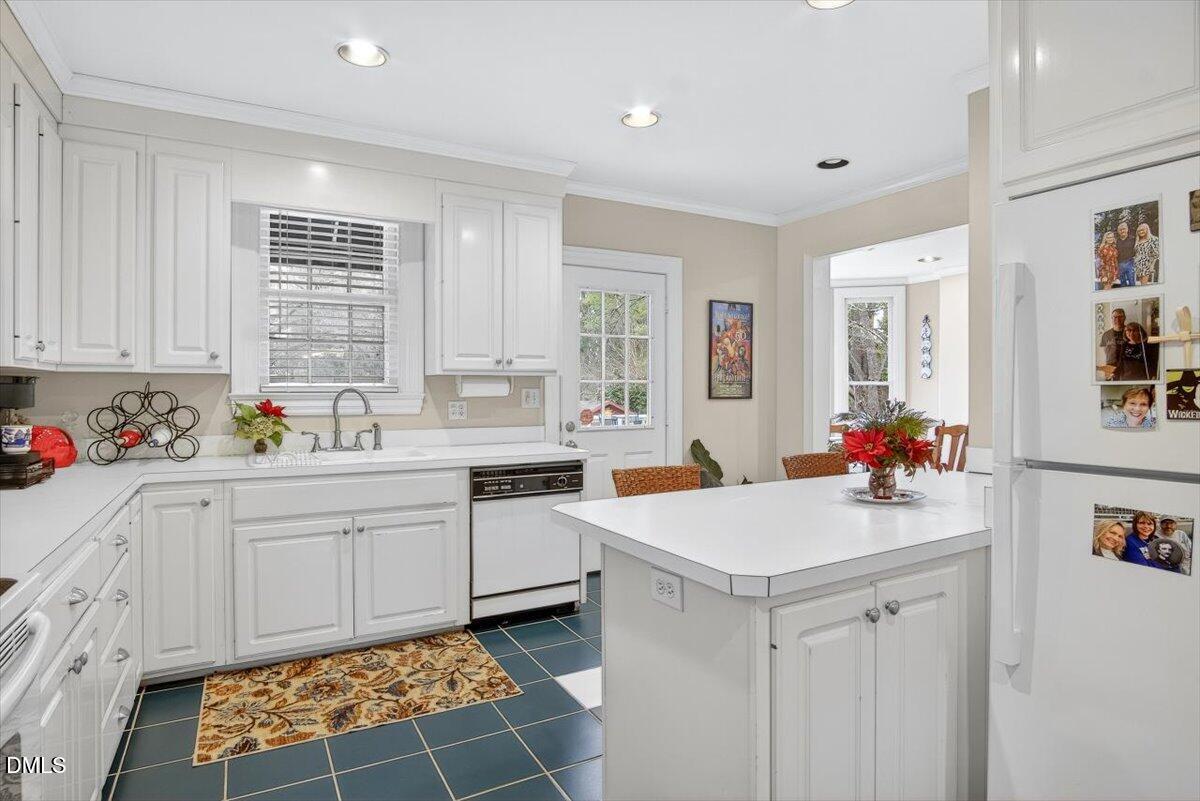 2064 Oxford Road Henderson, NC 27536 - Photo 19 of 68 a kitchen with a sink cabinets and window