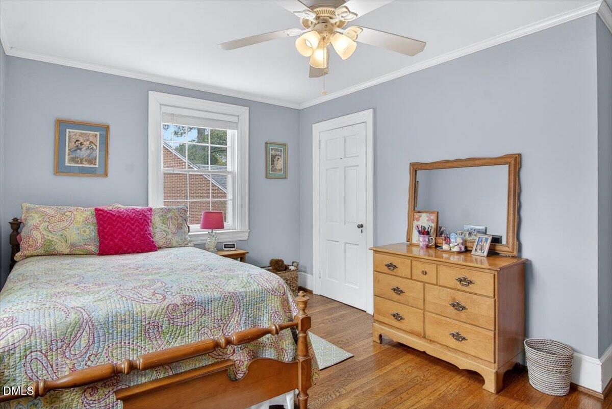2064 Oxford Road Henderson, NC 27536 - Photo 31 of 68 a bedroom with a bed and a dresser in it