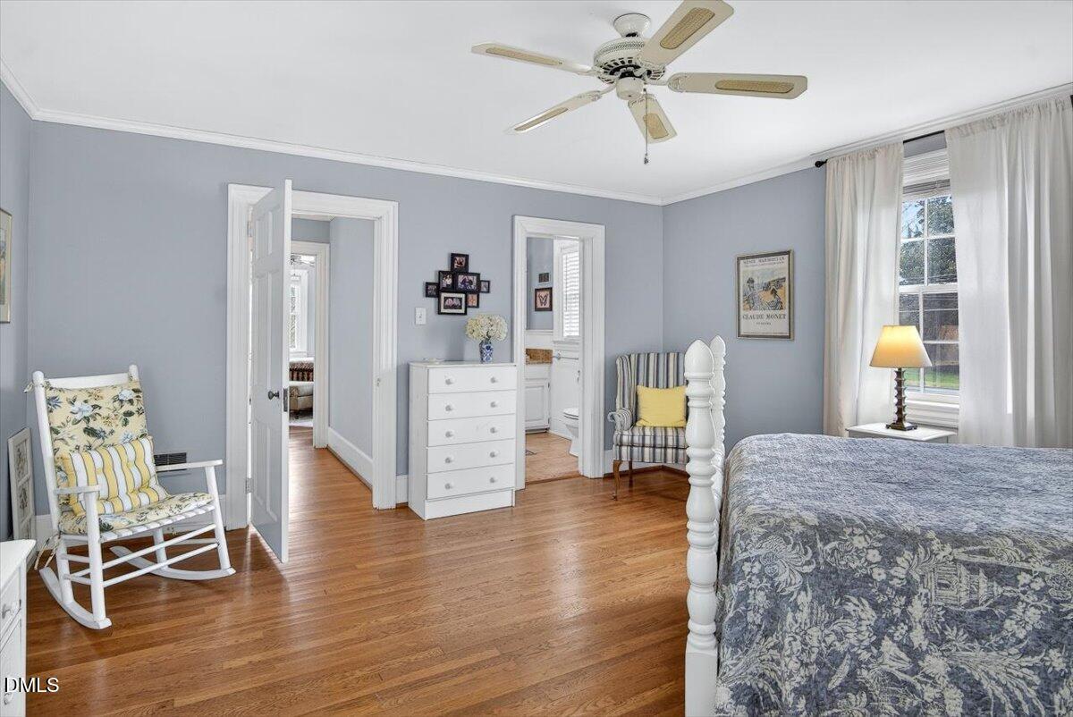 2064 Oxford Road Henderson, NC 27536 - Photo 38 of 68 a living room with furniture and a wooden floor