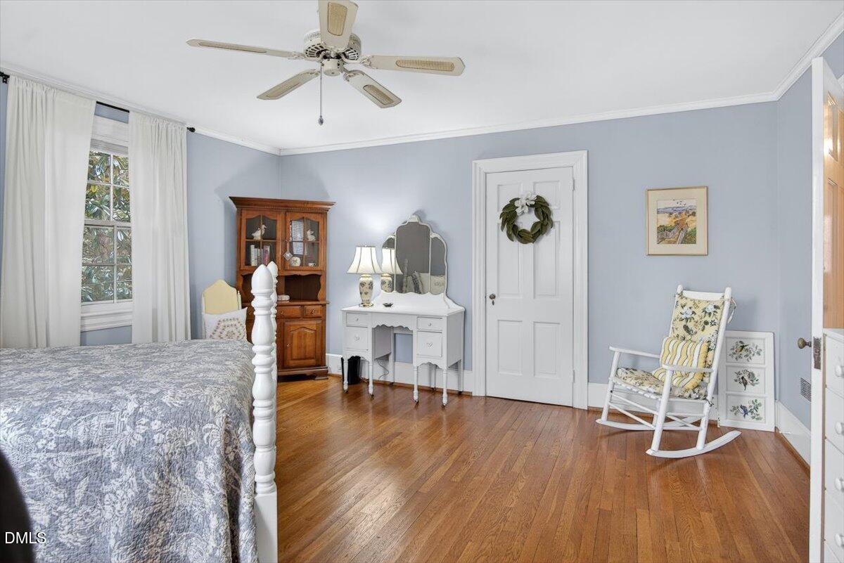 2064 Oxford Road Henderson, NC 27536 - Photo 40 of 68 a living room with furniture and a wooden floor