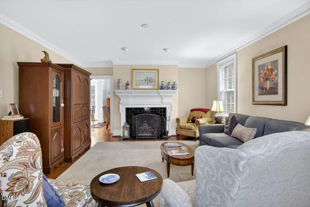 a view of a dining room with furniture and chandelier