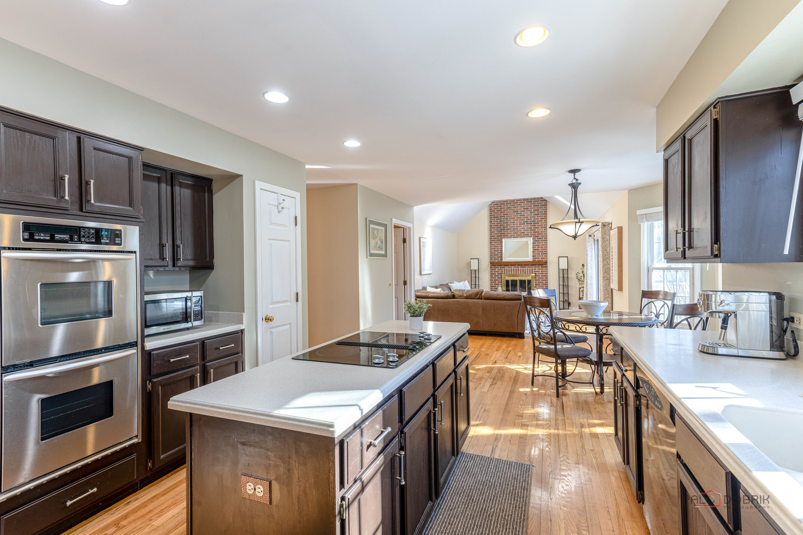 275 East Saddle Back Road Vernon Hills, IL 60061 - Photo 9 of 32 a kitchen with stainless steel appliances a stove sink and cabinets