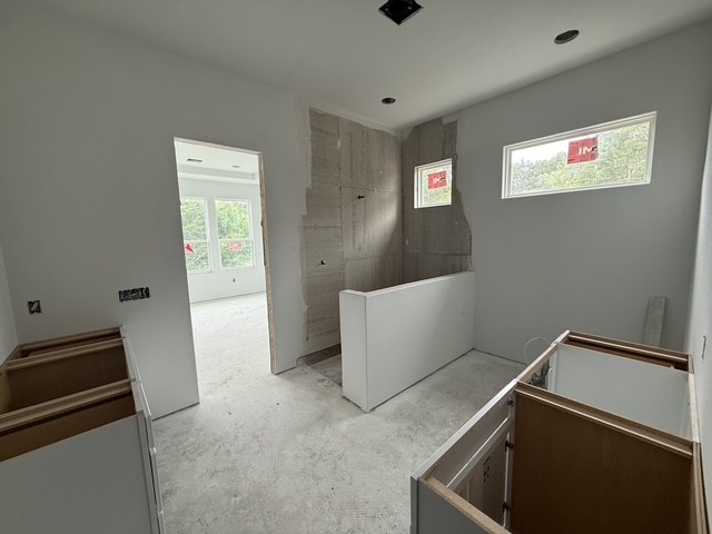 127 Riparian Elms Road Bertram, TX 78605 - Photo 11 of 22 A promising kitchen space awaits a culinary vision, featuring recessed lighting and ample room for design.