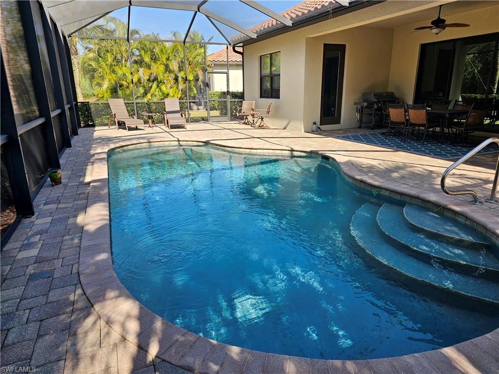 9387 Vercelli Court Naples, FL 34113 - Photo 14 of 25 a view of swimming pool from a living room