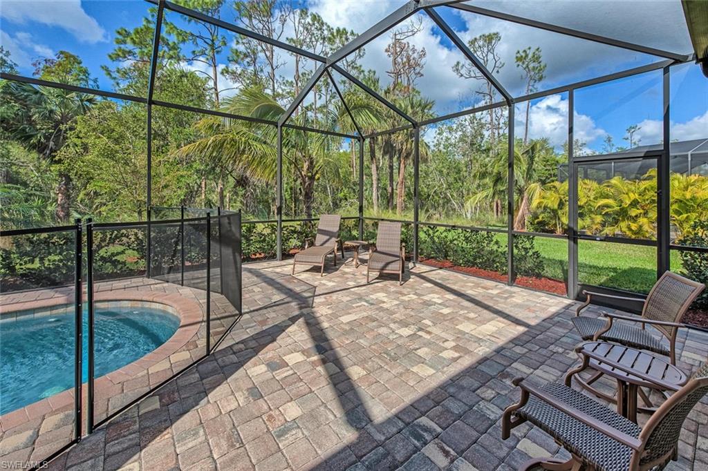 9387 Vercelli Court Naples, FL 34113 - Photo 16 of 25 a view of an outdoor sitting area with a backyard
