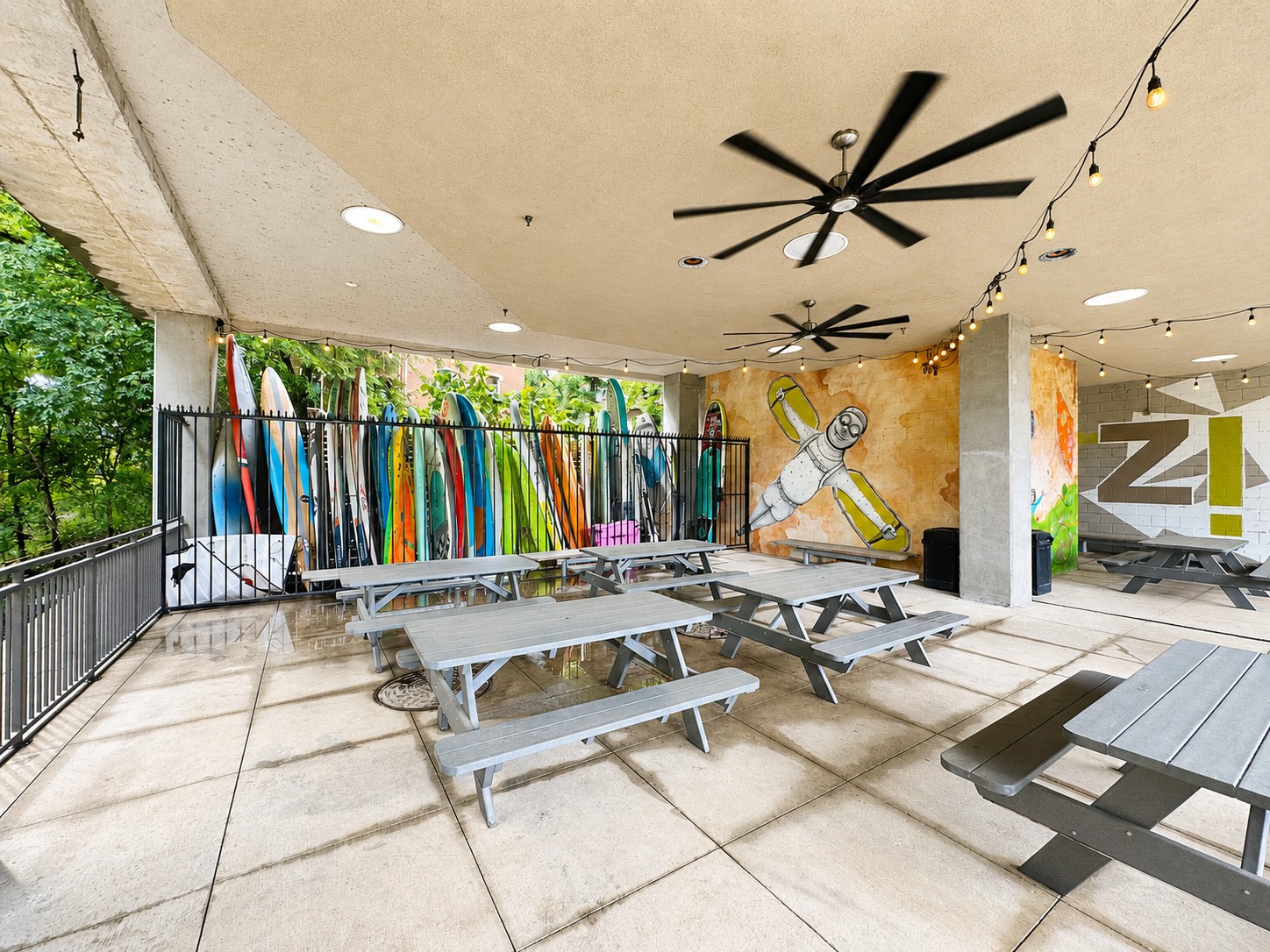 1900 Barton Springs Road, Unit 3036 Austin, TX 78704 - Photo 15 of 19 An inviting outdoor gathering space with ample seating and eclectic wall art & paddle board storage. Easy access to trails that lead to Zilker Park