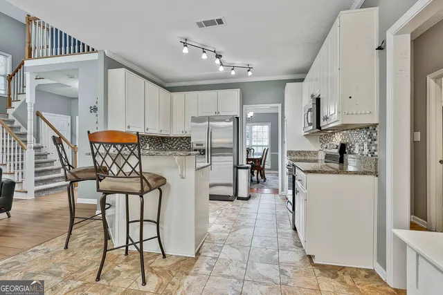 a bathroom with bathtub and a window