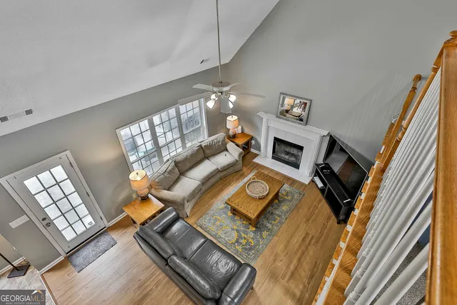 a backyard of a house with table and chairs