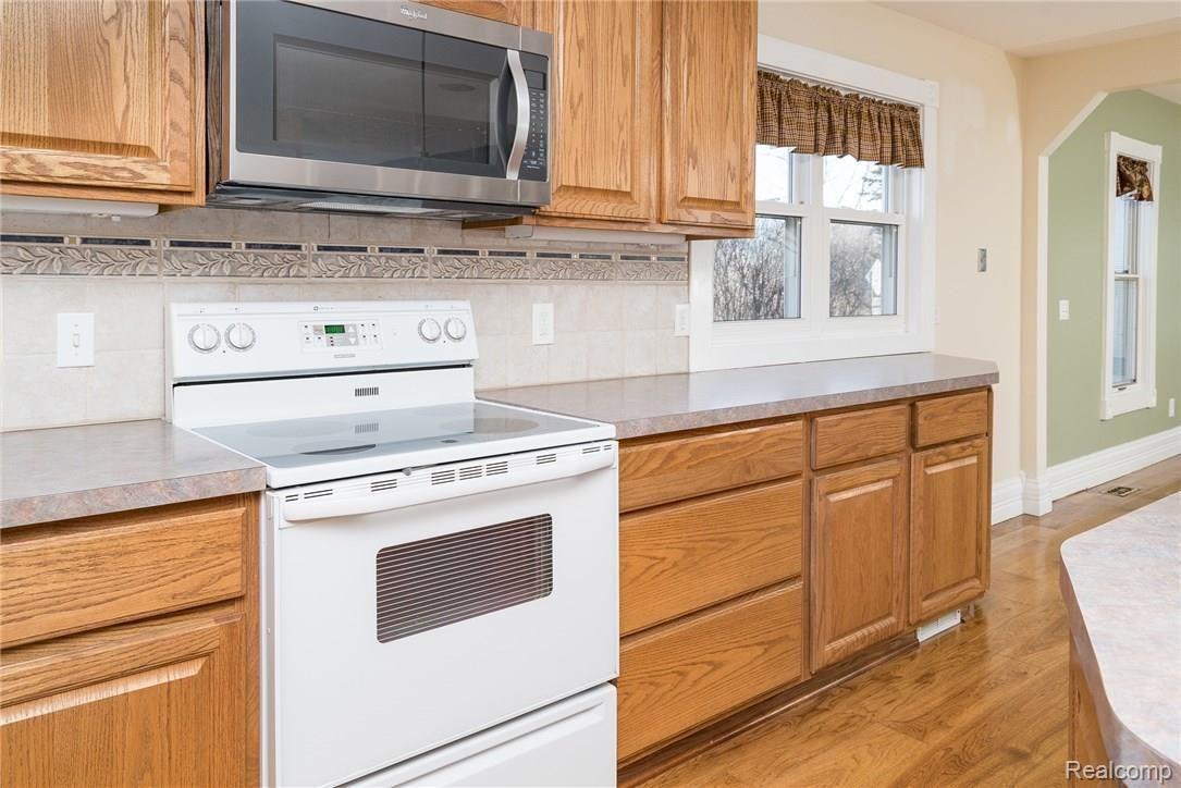 1290 7 Mile Road Whitmore Lake, MI 48189 - Photo 11 of 34 Cooking Area with Spacious Countertops