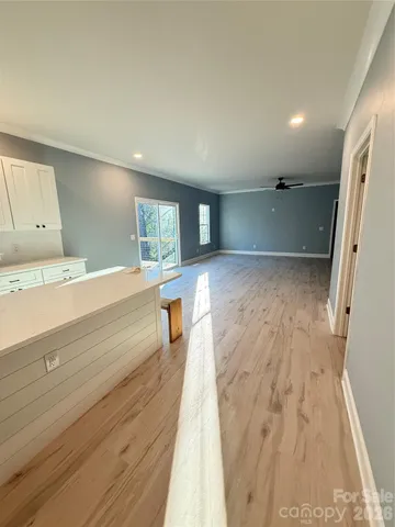 a view of kitchen and wooden floor