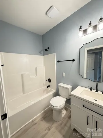 a bathroom with a sink a toilet and a bathtub