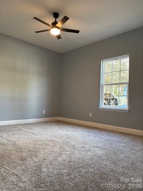 1705 Kallaramo Road Rock Hill, SC 29732 - Photo 10 of 15 an empty room with windows and fan