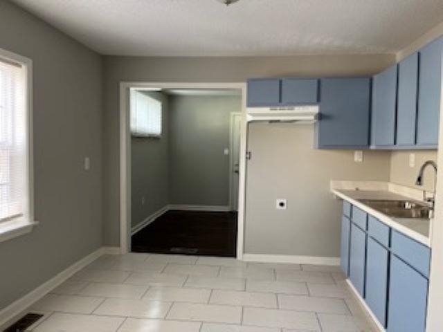 2060 Riverside Boulevard Memphis, TN 38109 - Photo 3 of 13 a kitchen with a refrigerator and a sink