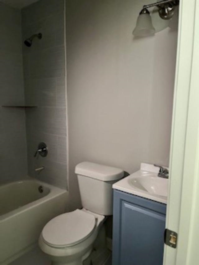 2060 Riverside Boulevard Memphis, TN 38109 - Photo 5 of 13 a white toilet sitting next to a bath tub