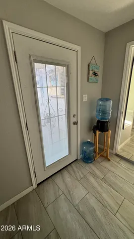 a view of an entryway with wooden floor