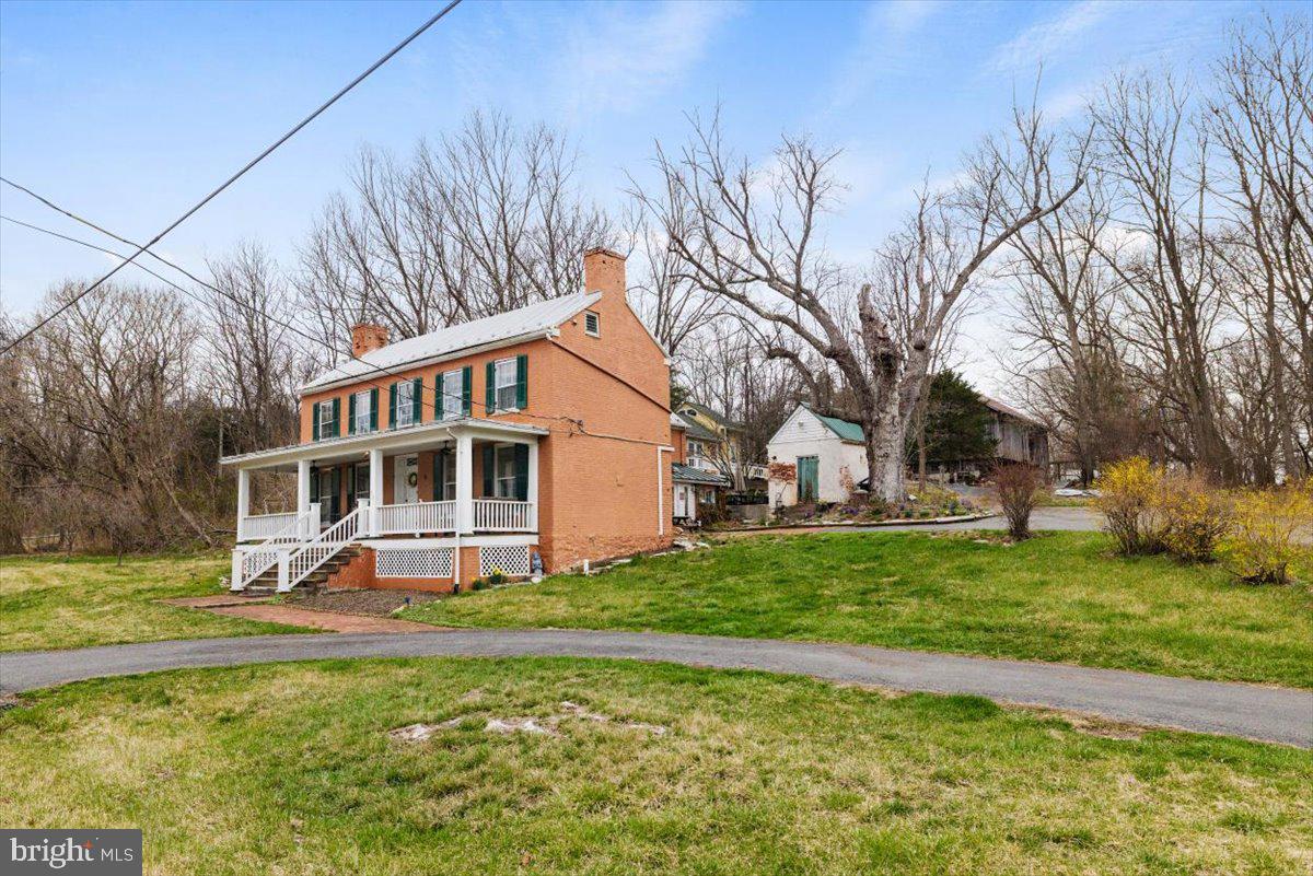 4781 Scrabble Road Shepherdstown, WV 25443 - Photo 11 of 61 a view of a house with a yard