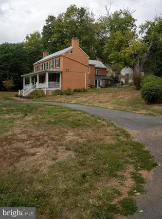 a front view of a house with stairs