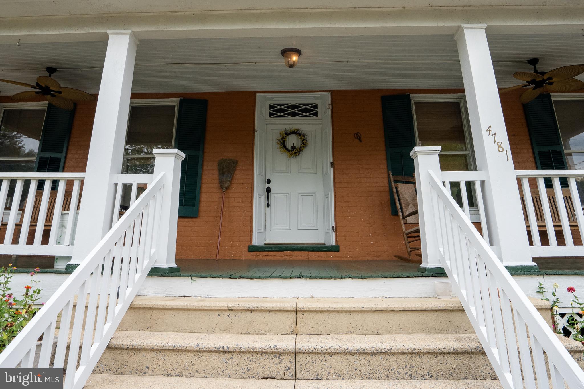 4781 Scrabble Road Shepherdstown, WV 25443 - Photo 15 of 61 a front view of a house with stairs