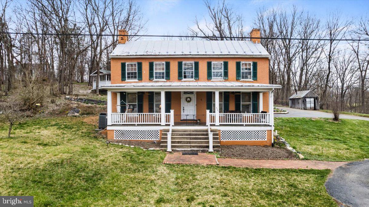4781 Scrabble Road Shepherdstown, WV 25443 - Photo 2 of 61 a front view of a house with a yard
