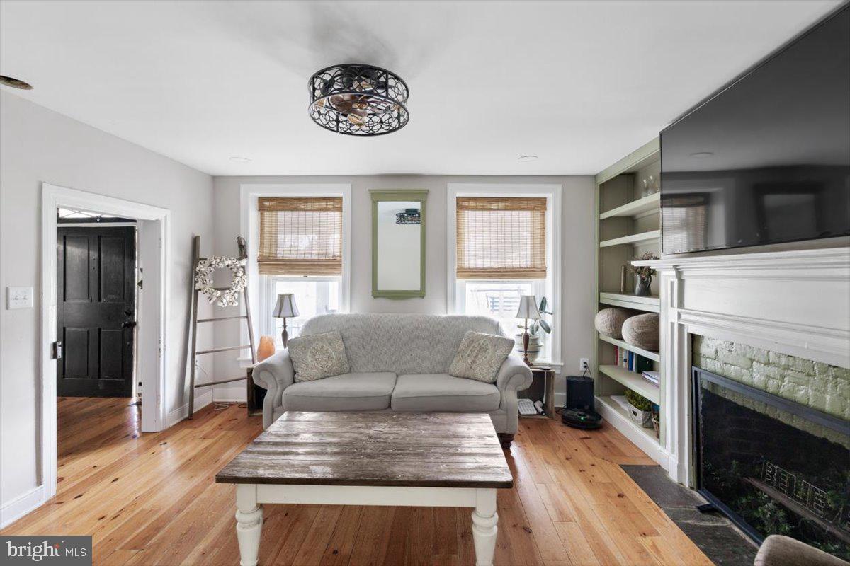 4781 Scrabble Road Shepherdstown, WV 25443 - Photo 21 of 61 a living room with furniture and a fireplace