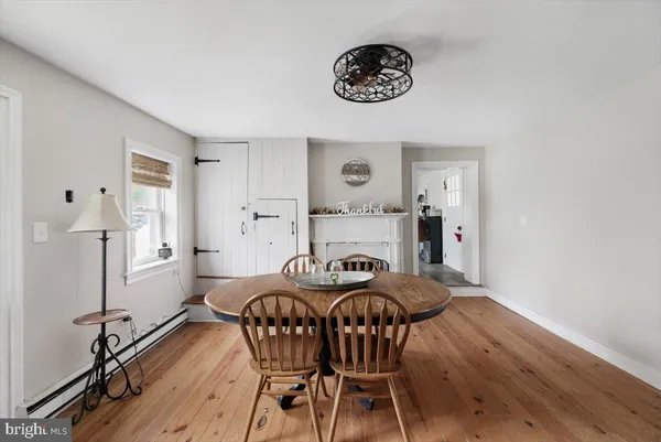 a kitchen with furniture and a fireplace