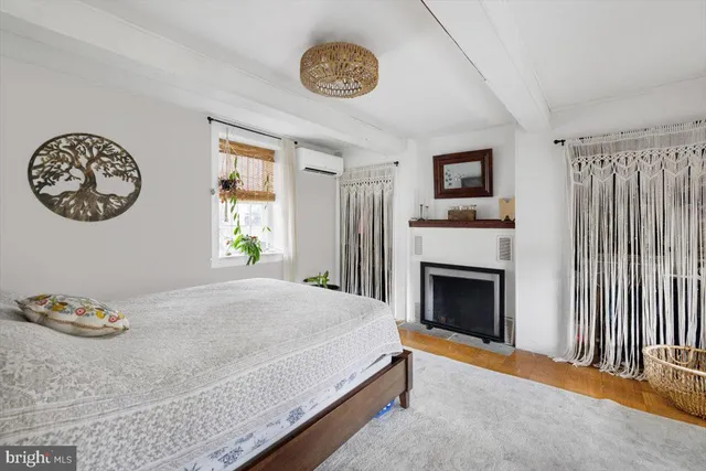 a bedroom with a bed and a window