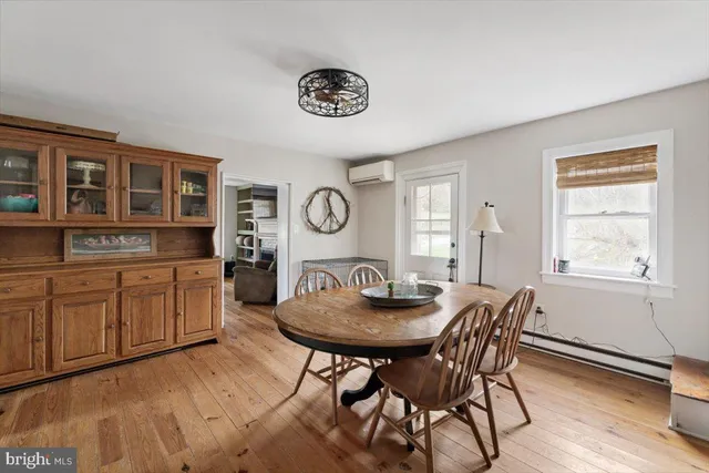 a bedroom with a bed table and a window