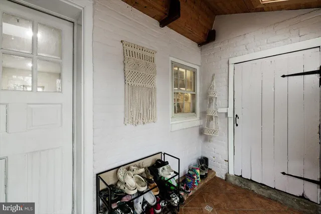 a bedroom with a bed and a wall painting