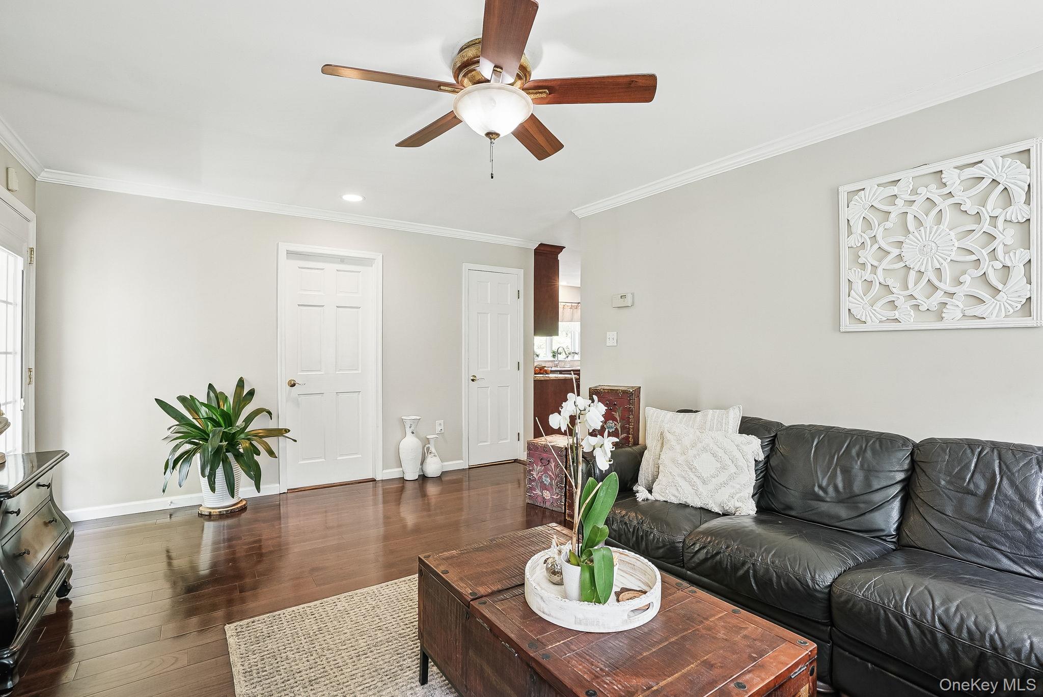 304 Church Road Putnam Valley, NY 10579 - Photo 17 of 50 Living room featuring a ceiling fan, dark wood finished floors, crown molding, baseboards, and recessed lighting