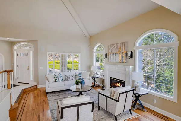 a kitchen with granite countertop a sink appliances cabinets and furniture