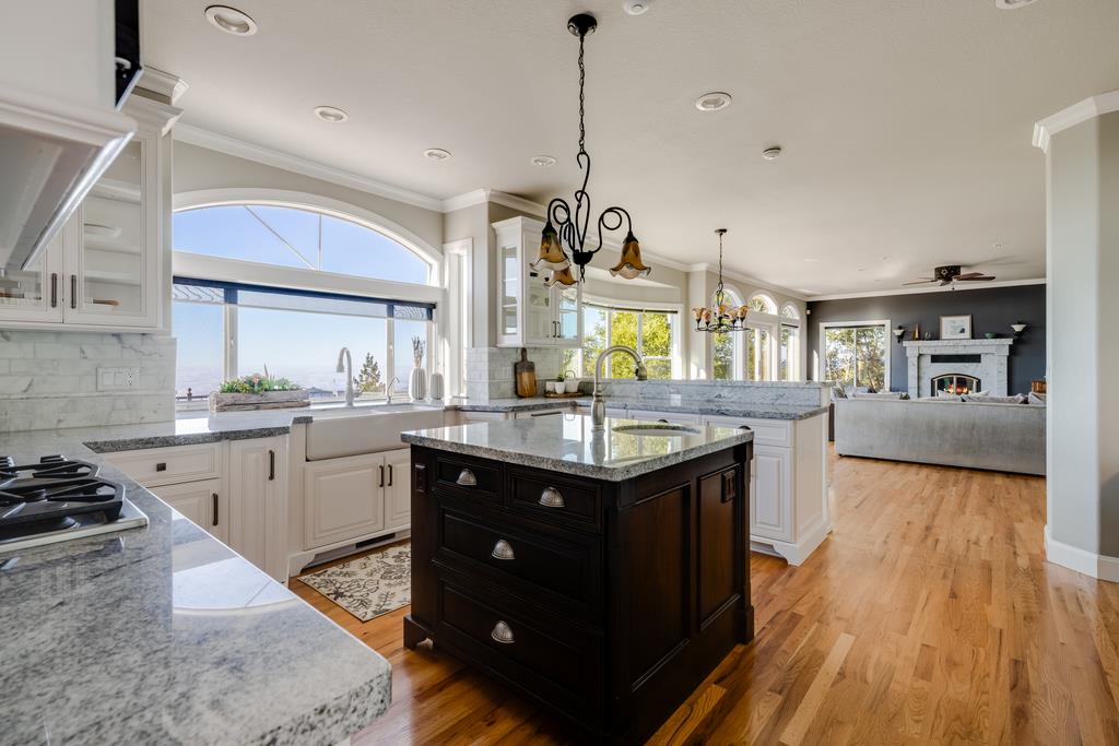 25220 Quail Ridge Road Los Gatos, CA 95033 - Photo 21 of 94 a kitchen with granite countertop a sink appliances and cabinets
