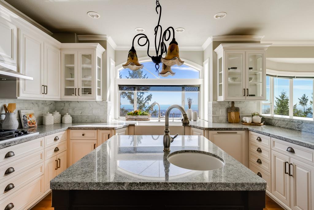 25220 Quail Ridge Road Los Gatos, CA 95033 - Photo 24 of 94 a kitchen with granite countertop a sink a stove and cabinets