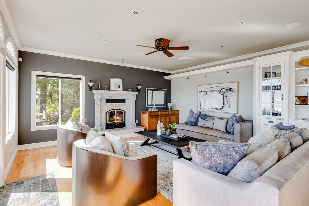 25220 Quail Ridge Road Los Gatos, CA 95033 - Photo 37 of 94 a living room with furniture a fireplace and a flat screen tv