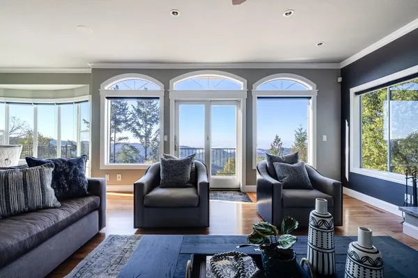 a living room with furniture and a lamp