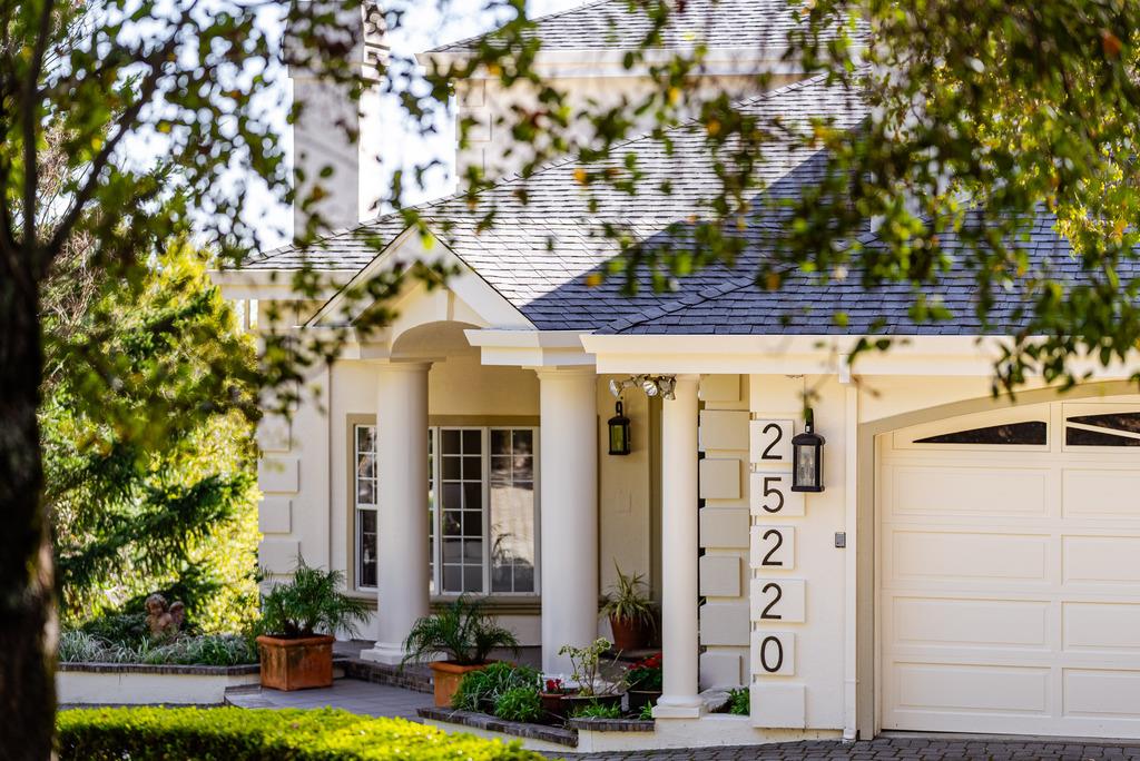 25220 Quail Ridge Road Los Gatos, CA 95033 - Photo 4 of 94 a front view of a building with tree s