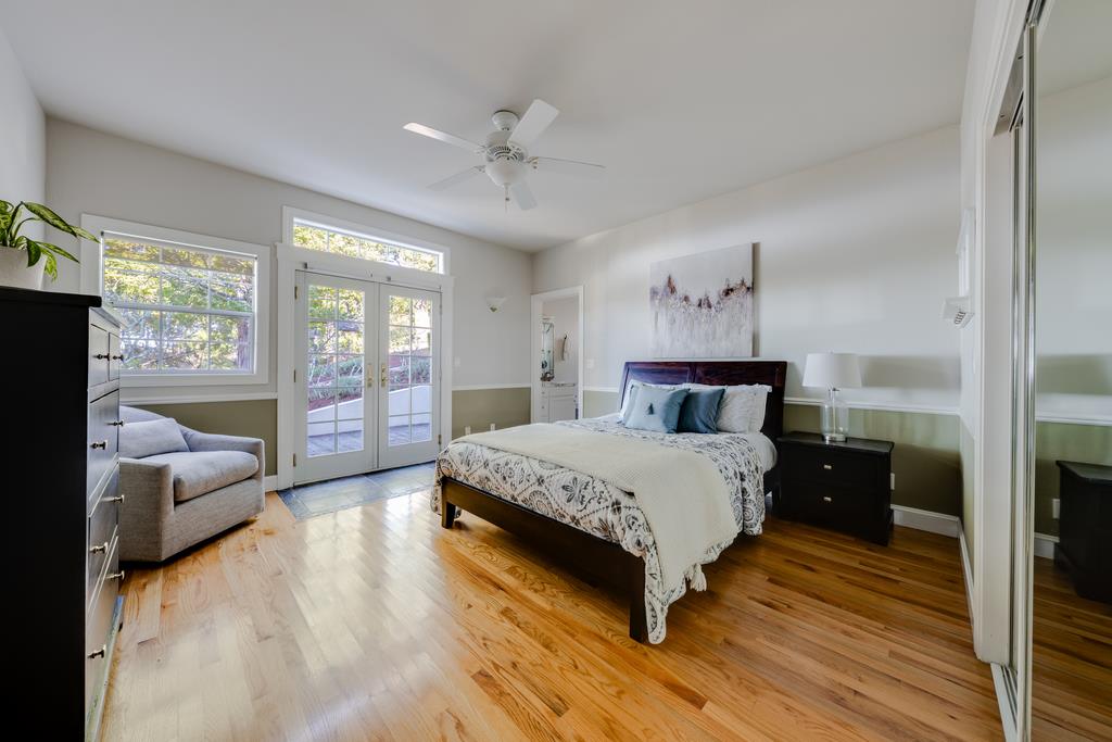 25220 Quail Ridge Road Los Gatos, CA 95033 - Photo 47 of 94 a spacious bedroom with a large bed and a large window