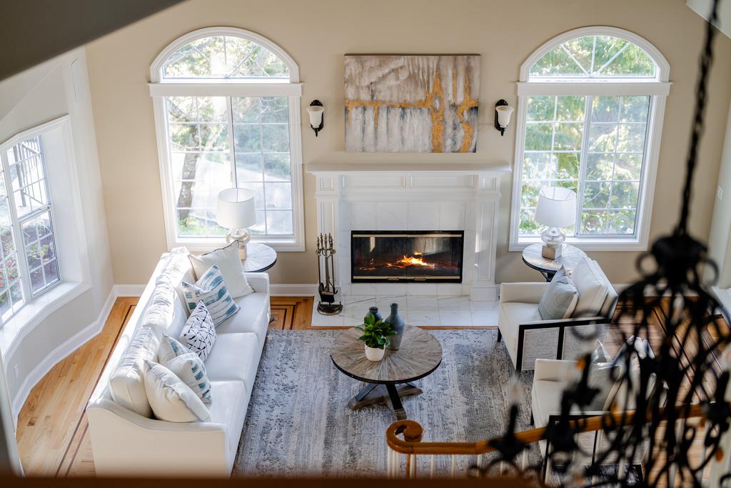 25220 Quail Ridge Road Los Gatos, CA 95033 - Photo 50 of 94 a living room with furniture a large window and a fireplace