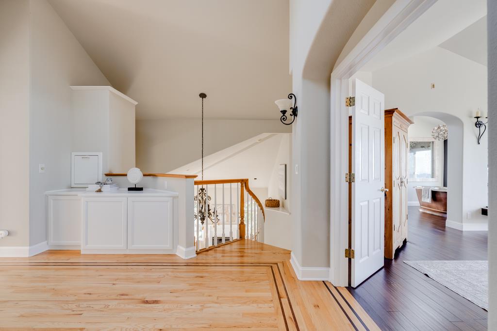 25220 Quail Ridge Road Los Gatos, CA 95033 - Photo 51 of 94 a view of a hallway with wooden floor and staircase