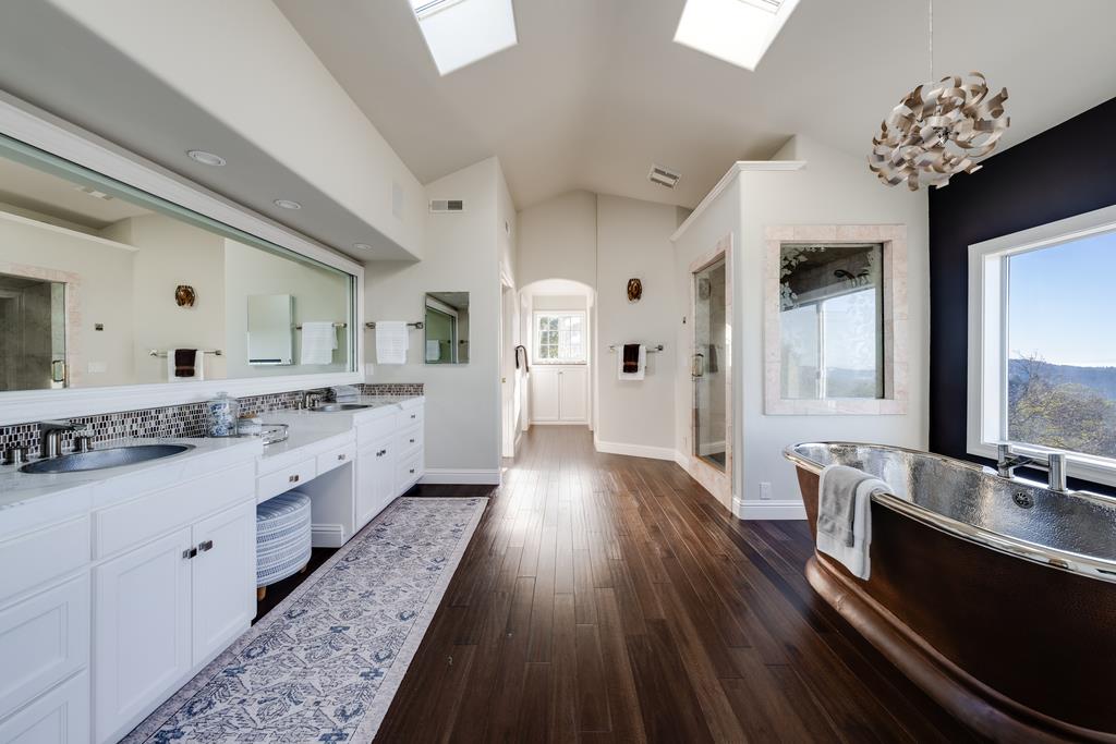 25220 Quail Ridge Road Los Gatos, CA 95033 - Photo 63 of 94 a large kitchen with a lot of counter space and wooden floor