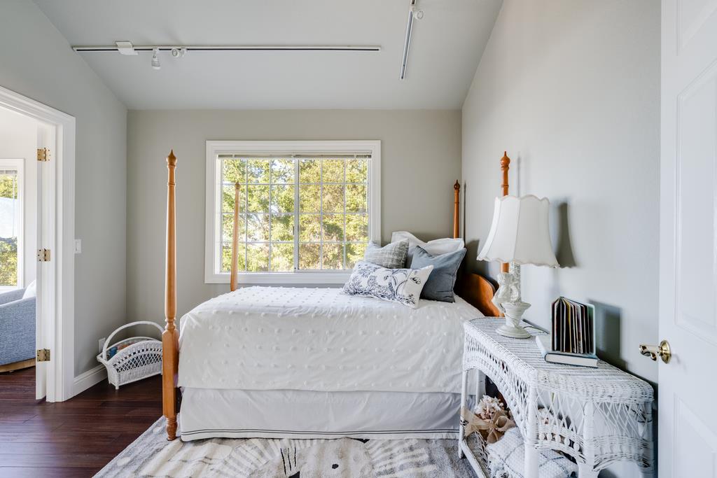 25220 Quail Ridge Road Los Gatos, CA 95033 - Photo 70 of 94 a bedroom with a bed and flat screen tv