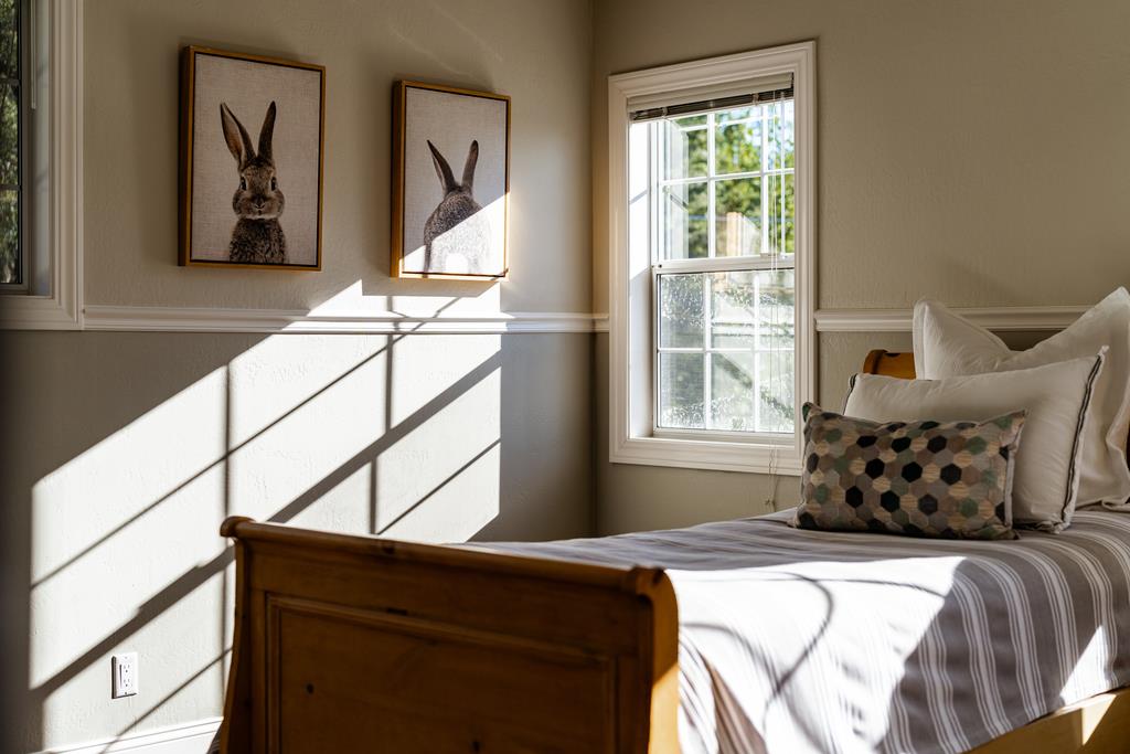 25220 Quail Ridge Road Los Gatos, CA 95033 - Photo 75 of 94 a bed sitting in a bedroom next to a window