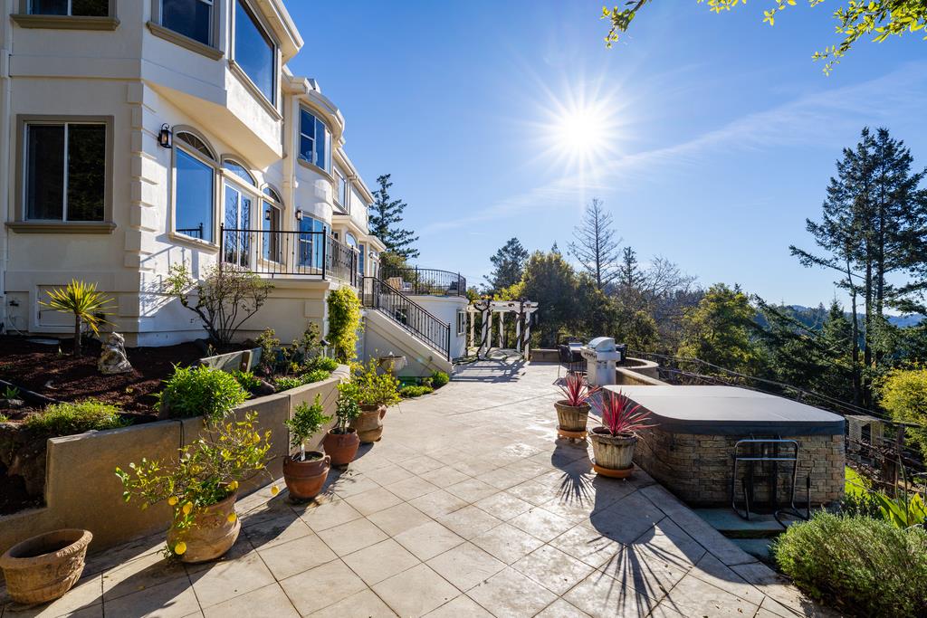 25220 Quail Ridge Road Los Gatos, CA 95033 - Photo 78 of 94 a view of a patio with table and chairs potted plants