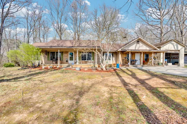 a front view of a building with a yard