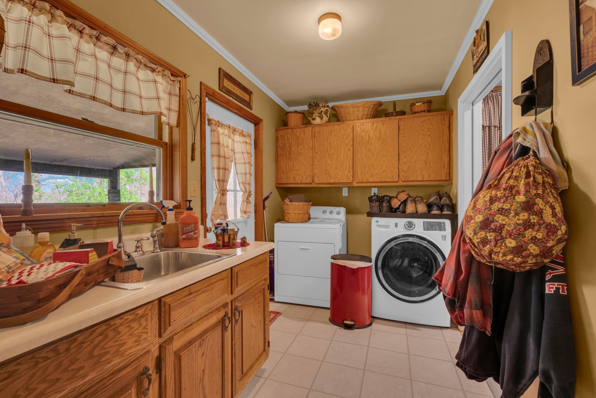 139 Bilbrey Road Livingston, TN 38570 - Photo 11 of 35 a view of a kitchen with a sink a washer and dryer