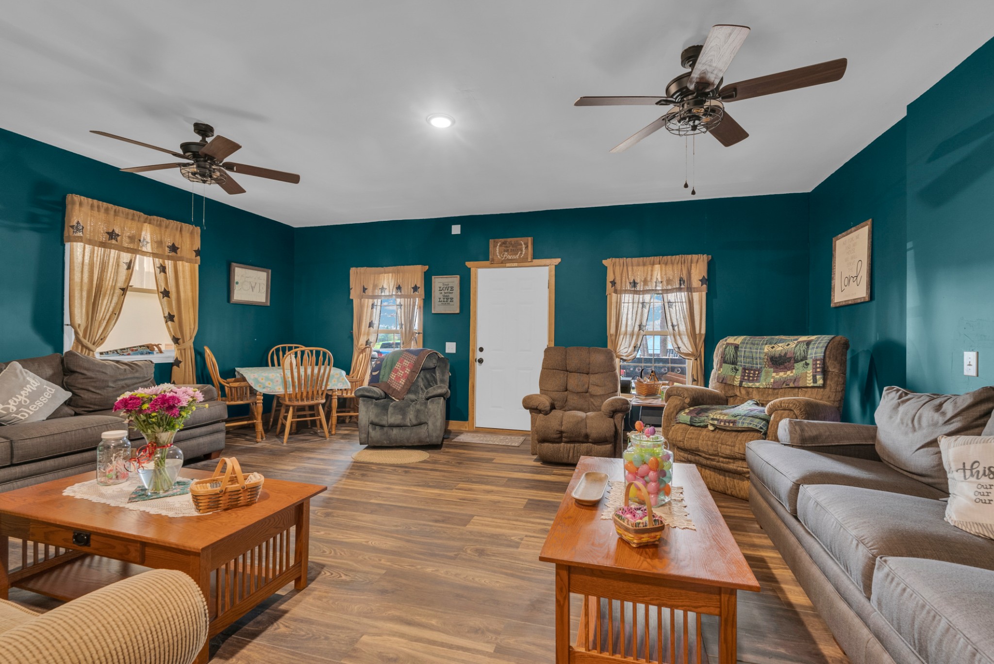139 Bilbrey Road Livingston, TN 38570 - Photo 12 of 35 a living room with furniture a ceiling fan and a window