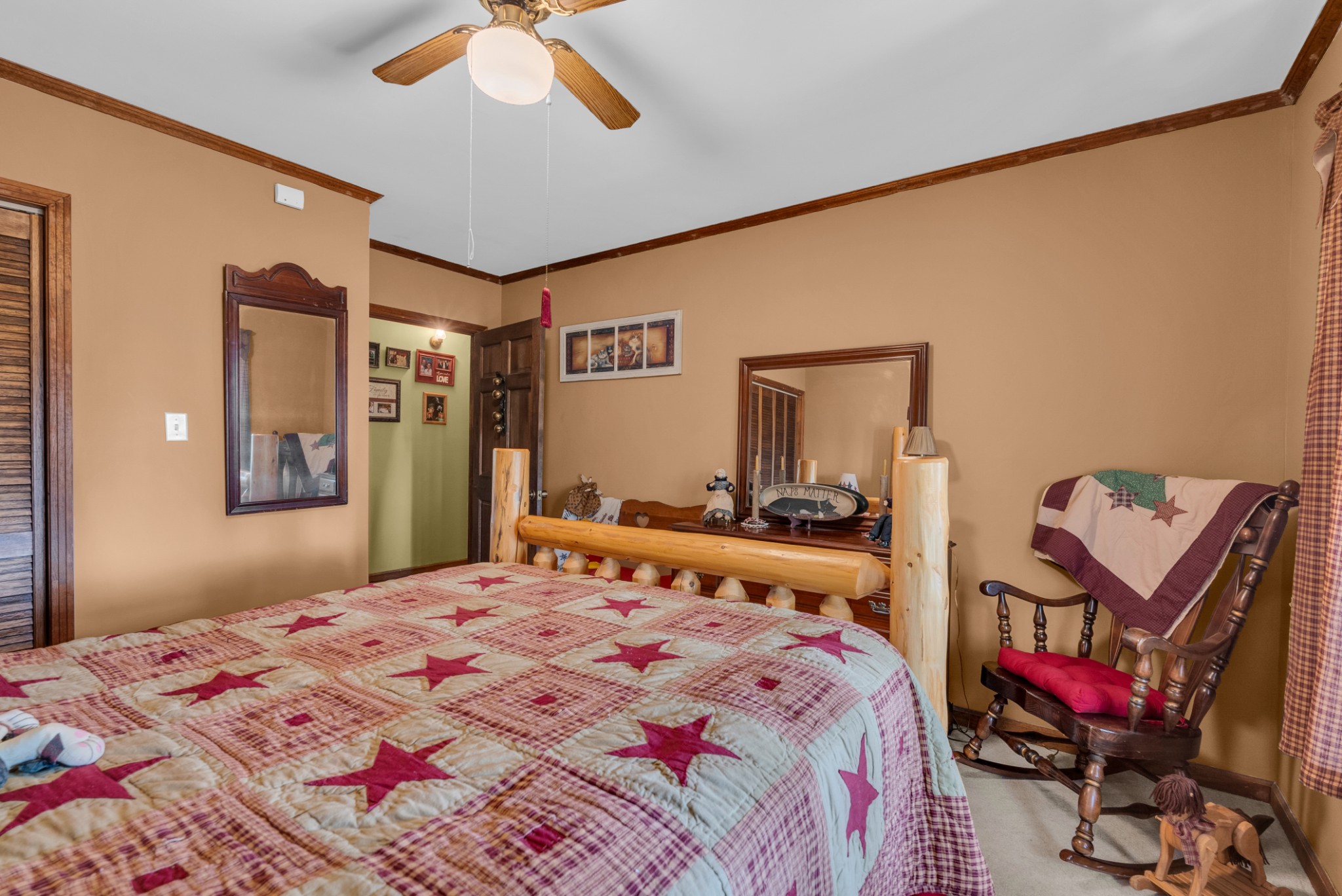 139 Bilbrey Road Livingston, TN 38570 - Photo 17 of 35 a bedroom with a bed and a chandelier