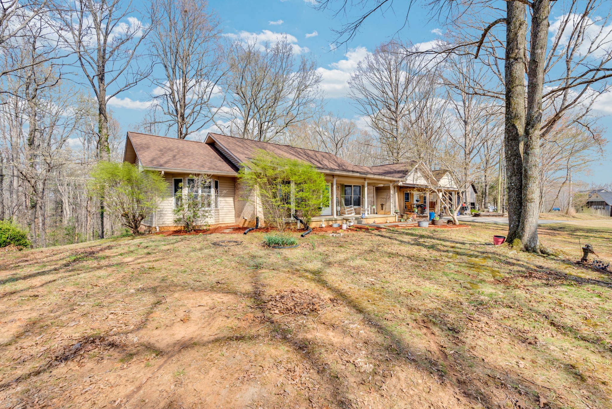 139 Bilbrey Road Livingston, TN 38570 - Photo 29 of 35 a view of a large white house with a large tree in the yard