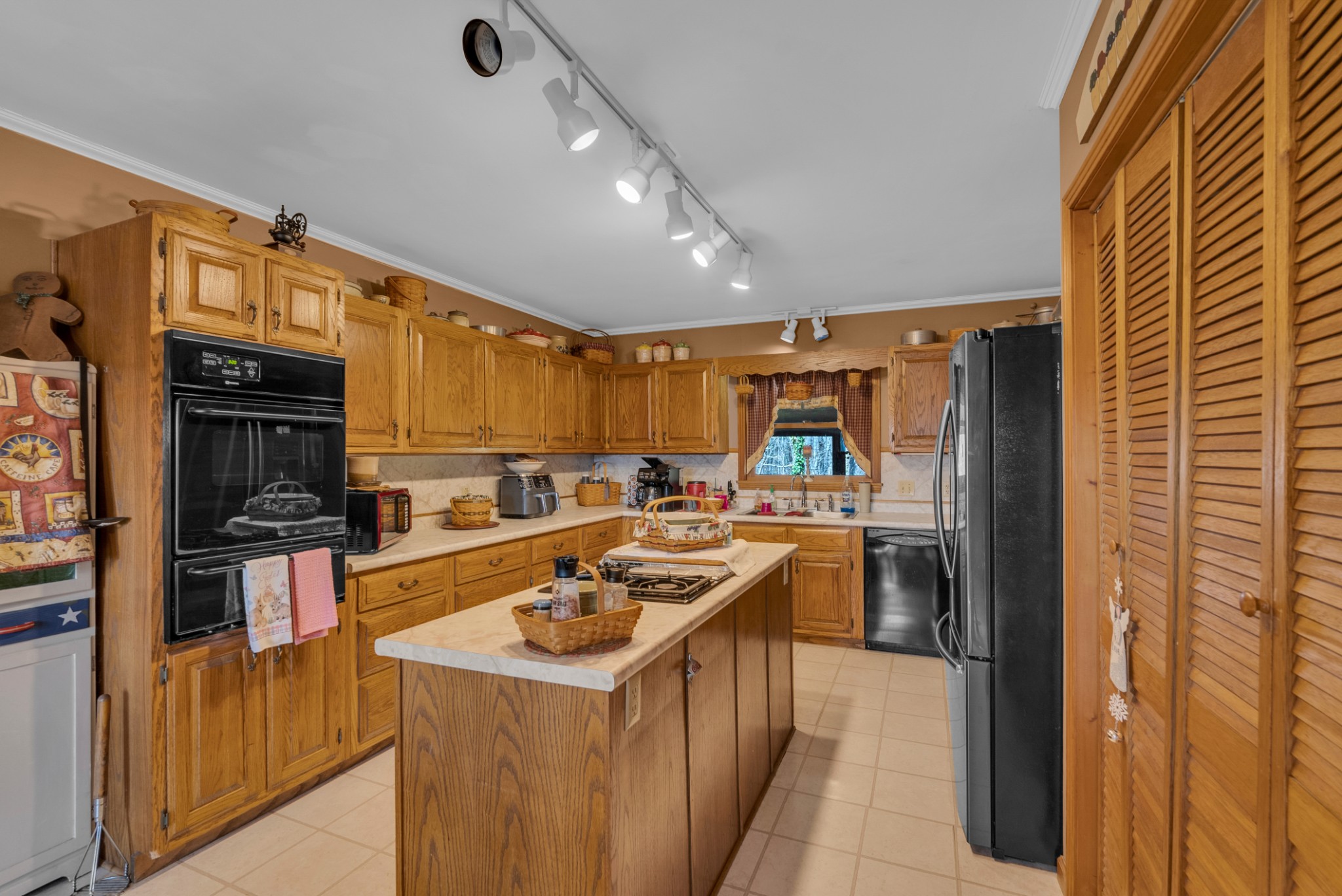 139 Bilbrey Road Livingston, TN 38570 - Photo 8 of 35 a kitchen that has a sink and a stove in it
