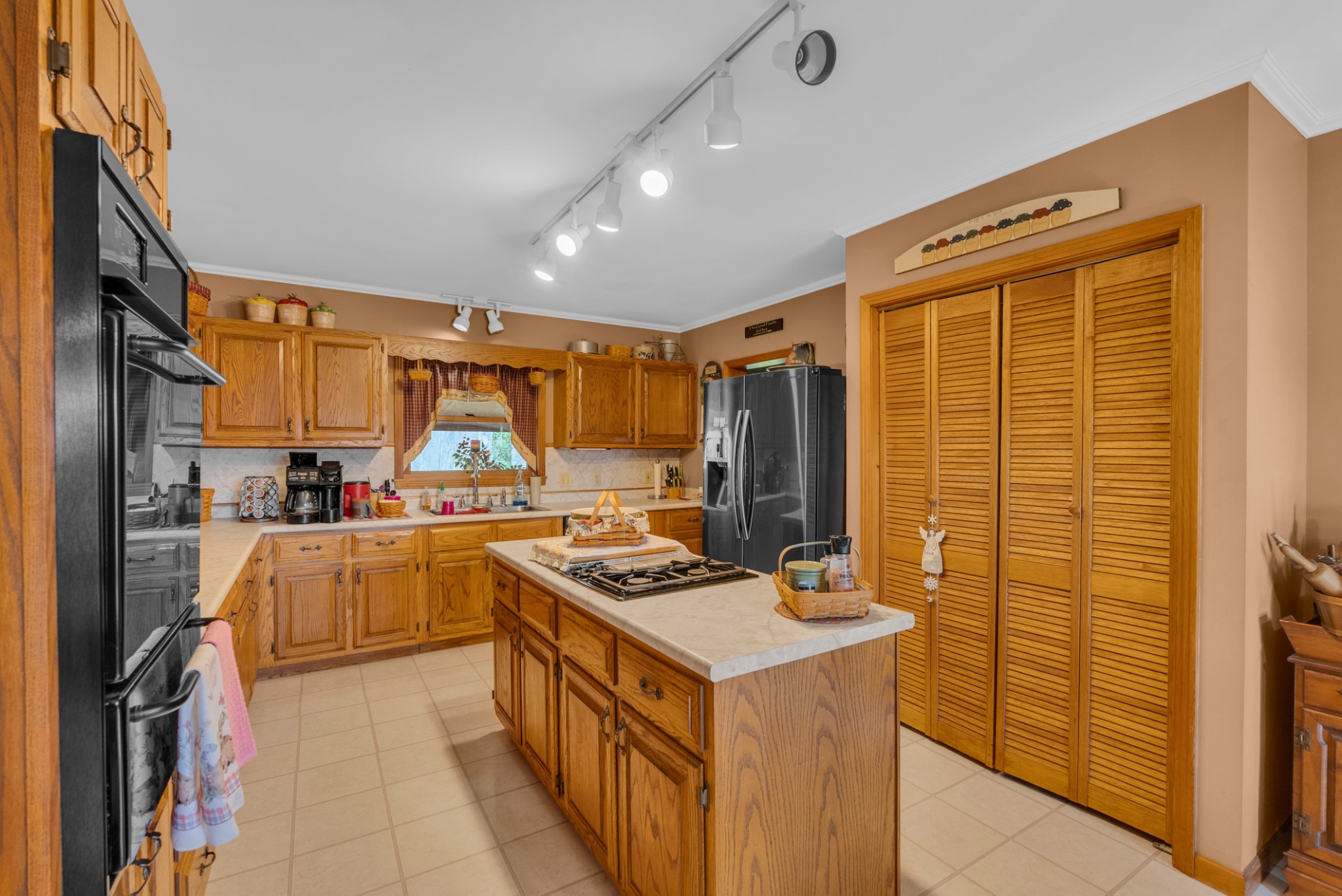 139 Bilbrey Road Livingston, TN 38570 - Photo 9 of 35 a kitchen with stainless steel appliances granite countertop a stove and a refrigerator