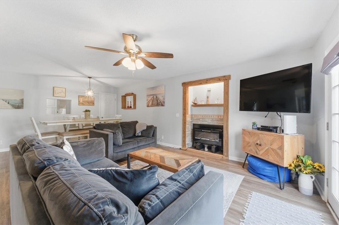 1000 Sea Island Road, Unit 68 St. Simons Island, GA 31522 - Photo 13 of 21 Living Room With Woodburning Fireplace or Glass Bead Insert